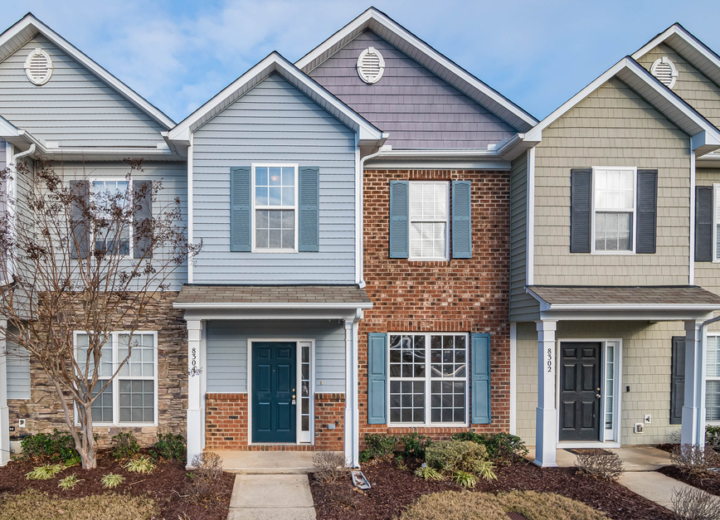 Elegant view of suburban townhouses showcasing diverse architectural styles.