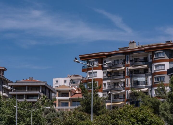 Stylish urban apartments in Bornova, İzmir under a clear blue sky.