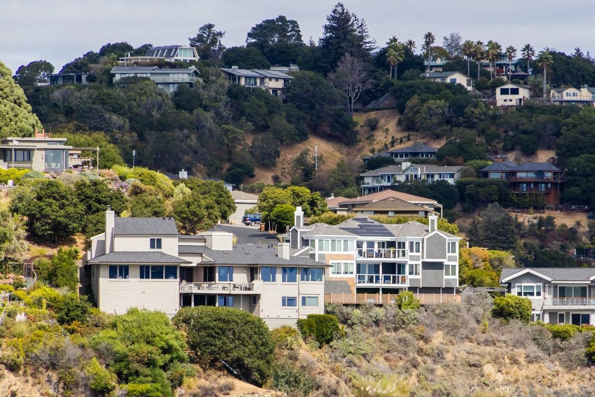 Houses on a wooded residential hillside