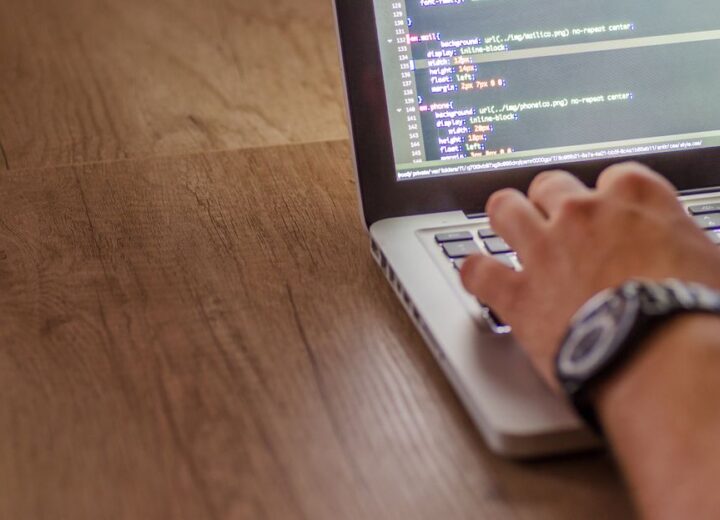 Website code and analytics on a laptop screen